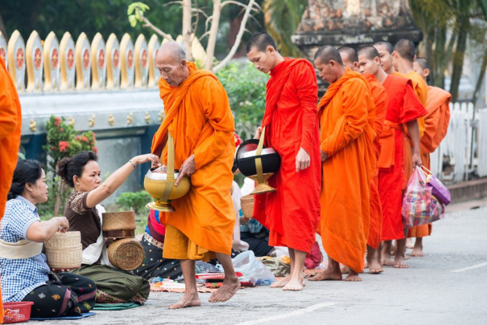 Don’t miss the alms-giving ceremony during your two-week trip to Luang Prabang